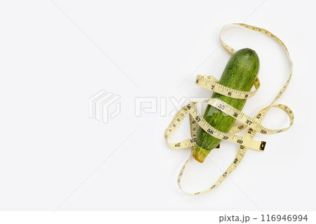 Zucchini with measuring tape on white background 116946994