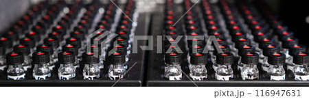 Samples in glass vials with black caps waiting for analysis in HPLC system.  116947631