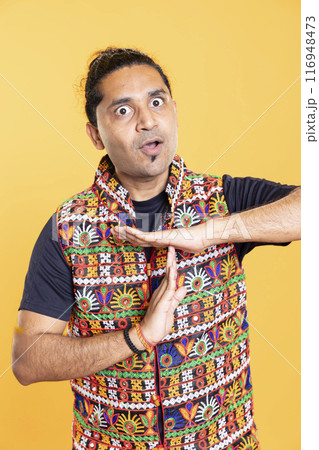 Angry man fed up with noise, requesting timeout, doing hand gestures. Zealous person doing insistent pause sign gesturing, wishing for break, isolated over studio background Angry man fed up with noise, requesting timeout, doing hand gestures. Zealous person doing insistent pause sign gesturing, wishing for break, isolated over studio background 116948473