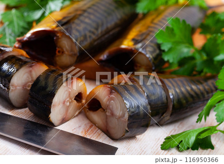 Sliced smoked mackerel with parsley 116950366