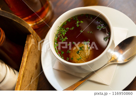 Bowl of beef soup with liver dumpling on table Bowl of beef soup with liver dumpling on table 116950860