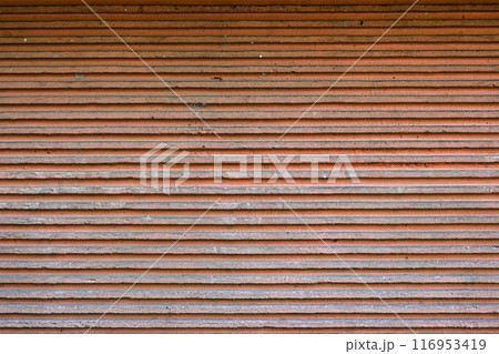 The image is of a brick wall with a brown and white color scheme 116953419