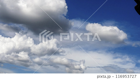 Blue sky fluffy white clouds on summer season bright clear skyline with beautiful cloudscape. Panorama blue sky clouds pattern on daylight with copy space. Cumulus cloudscape air climate sunny day 116953727