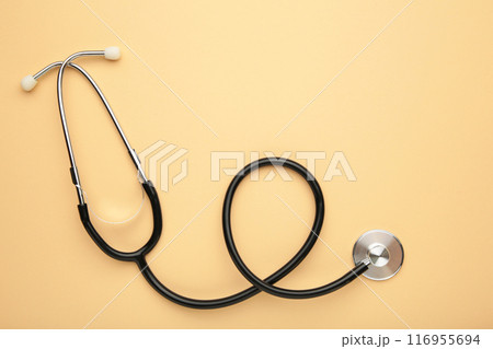 Stethoscope on beige background, top view. Medical students stuff 116955694