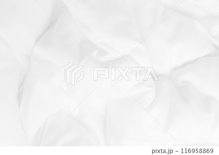 Close up top view of white bedding sheet and wrinkle messy blanket in bedroom after wake up in the morning. 116958869