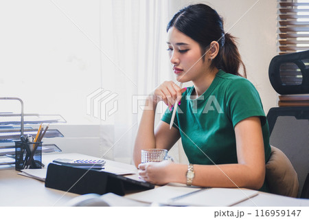 Businesswoman is thinking and is stressed about work. 116959147