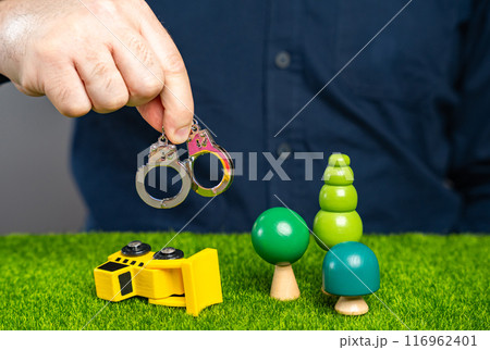 Man prevents deforestation, concept. Stop the forest from being cut down. Save nature. Protection of natural conservation areas. Deforestation. Arrest for damaging nature. Man prevents deforestation, concept. Stop the forest from being cut down. Save nature. Protection of natural conservation areas. Deforestation. Arrest for damaging nature. 116962401