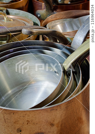 Big group of stacked classic copper saucepans Big group of stacked classic copper saucepans 116964034