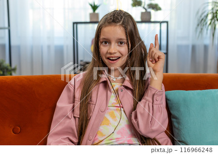 Inspired child girl pointing finger up having good idea plan showing inspiration motivation gesture Inspired child girl pointing finger up having good idea plan showing inspiration motivation gesture 116966248