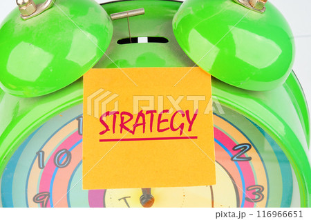 STRATEGY word written on a sticker glued to the clock, alarm clock STRATEGY word written on a sticker glued to the clock, alarm clock 116966651