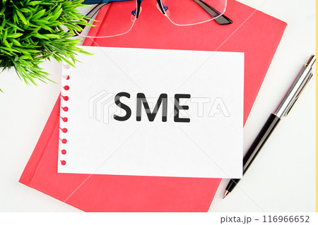 Startup small business entrepreneur SME. Small Medium Enterprises acronym. SME concept word in a white notebook on a red business book Startup small business entrepreneur SME. Small Medium Enterprises acronym. SME concept word in a white notebook on a red business book 116966652