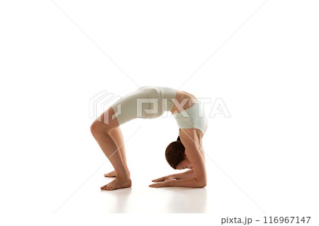 Woman practices forearm wheel pose, enhancing...の写真素材 [116967147] - PIXTA