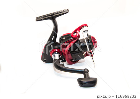 Red fishing reel for rod and spinning on white background 116968232