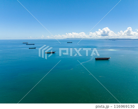 Sea bay with cargo and merchant ship. Seascape. Mindanao, Philippines. Sea bay with cargo and merchant ship. Seascape. Mindanao, Philippines. 116969130
