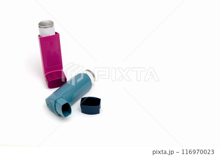 Asthma medications inhalers on a white background. 116970023