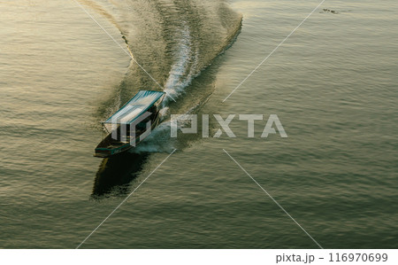 Long tail boat in the lake on the river in Sangkhla Buri Long tail boat in the lake on the river in Sangkhla Buri 116970699