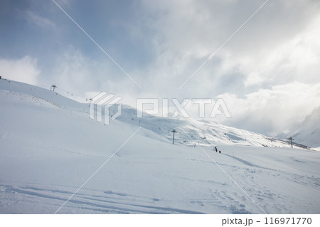 Ski lift on a snowy slope in French Alps Ski lift on a snowy slope in French Alps 116971770