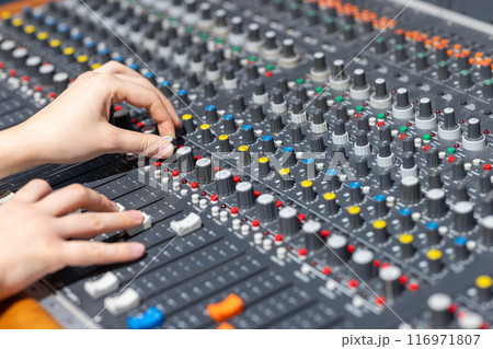 Closeup of audio mixer control panel 116971807