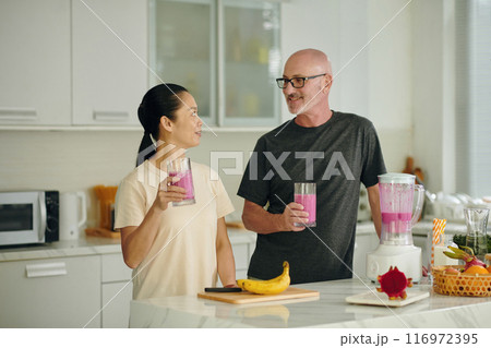 Preparing Smoothies in Modern Kitchen Setting Preparing Smoothies in Modern Kitchen Setting 116972395