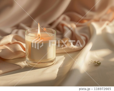 Candle mockup, A beautiful Serene Candle placed delicately on Soft Fabric illuminated with Gentle Lighting 116972665