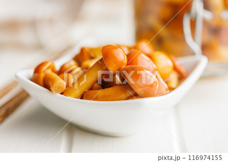Pickled nameko mushrooms.Traditional japanese mushrooms in bowl on white table. 116974155