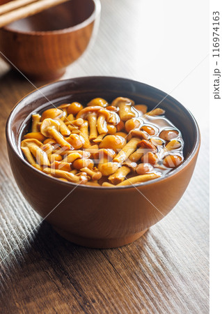 Pickled nameko mushrooms.Traditional japanese mushrooms in bowl on wooden table. 116974163
