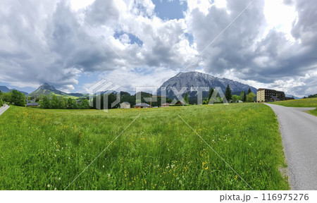 Summer austrian landscape with Grimming mountain (2.351 m), an isolated peak in the Dachstein Mountains, view from small alpine village Tauplitz, Styria, Austria 116975276