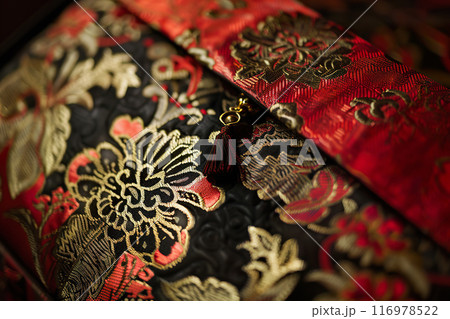 Elegant Floral Evening Bag with Gold Embroidery and Tassel Accent. 116978522