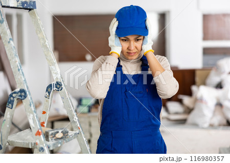 Female foreman unhappy with work done indoors Female foreman unhappy with work done indoors 116980357