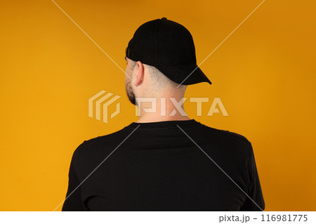 A young guy in a black t-shirt and cap A young guy in a black t-shirt and cap 116981775