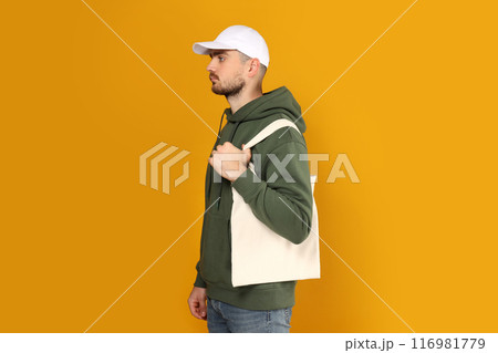 A guy in a thick coat with a bag on his shoulder A guy in a thick coat with a bag on his shoulder 116981779