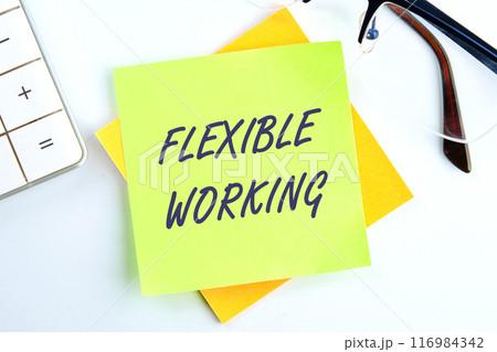 FLEXIBLE WORKING text on a sticker in a composition with a calculator and glasses on top on a white background 116984342