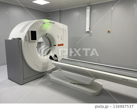 Modern hospital Computed Tomography room interior with device 116987537