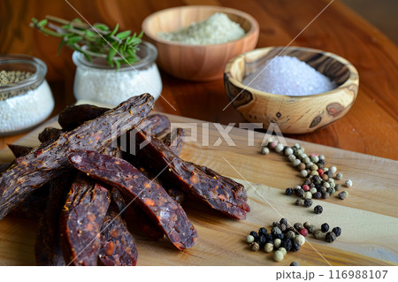 Sujuk - dried lamb or beef sausage with seasonings, ingredients nearby Sujuk - dried lamb or beef sausage with seasonings, ingredients nearby 116988107