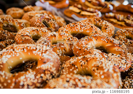 Traditional Turkish bagels with sesame seeds on a bakery counter early in the morning 116988195