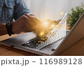 Casual Businessman Touch Mobile Phone and 2023 Stock Market Bar Chart or Graph Trend 116989128