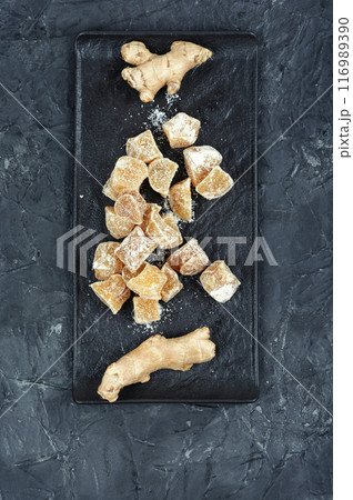 Ginger candies and fresh ginger. 116989390