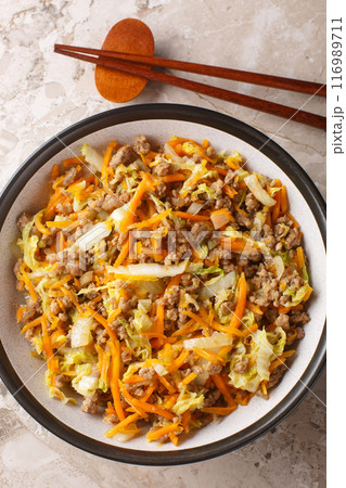 Egg roll bowl with vegetables and meat traditional asian food in one pot close-up. Vertical top view Egg roll bowl with vegetables and meat traditional asian food in one pot close-up. Vertical top view 116989711