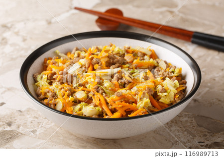 Eggroll in a bowl with coleslaw mix and ground beef closeup. Horizontal Eggroll in a bowl with coleslaw mix and ground beef closeup. Horizontal 116989713
