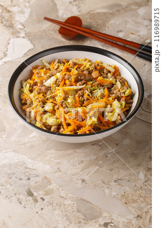 Egg roll bowl with vegetables and meat traditional asian food in one pot close-up. Vertical Egg roll bowl with vegetables and meat traditional asian food in one pot close-up. Vertical 116989715