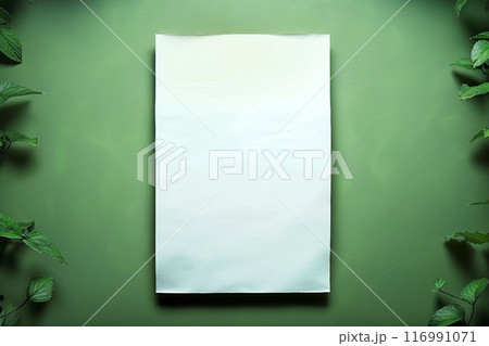 Empty white paper sheet isolated on green background 116991071