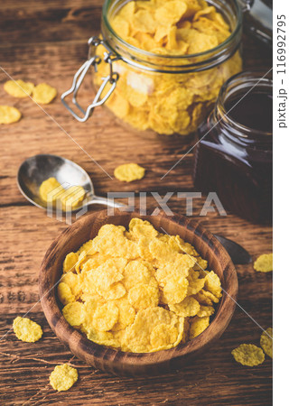 Breakfast with corn flakes, milk and jam 116992795
