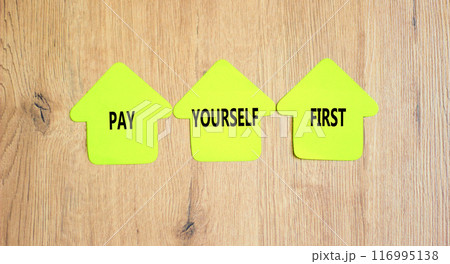 Pay yourself first symbol. Concept words Pay yourself first on beautiful yellow paper houses. Beautiful wooden table wooden background. Business and pay yourself first concept. Copy space. Pay yourself first symbol. Concept words Pay yourself first on beautiful yellow paper houses. Beautiful wooden table wooden background. Business and pay yourself first concept. Copy space. 116995138