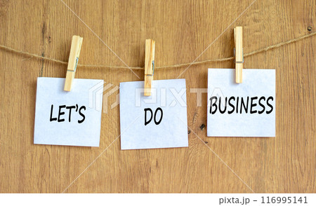 let is do business symbol. Concept words let is do business on beautiful white paper on clothespin. Beautiful wooden table wooden background. let is do business concept. Copy space. let is do business symbol. Concept words let is do business on beautiful white paper on clothespin. Beautiful wooden table wooden background. let is do business concept. Copy space. 116995141
