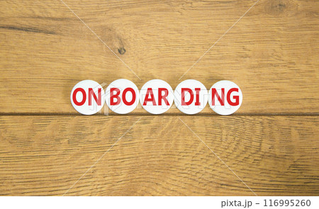 Onboarding success symbol. Concept word Onboarding on white pill. Beautiful wooden background. Business onboarding success concept. Copy space. 116995260