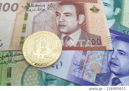 Bitcoin on a stack of Moroccan dirham banknotes 116995611
