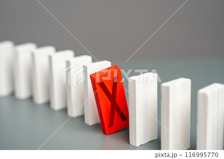 The red domino with a cross hinders the whole process. Breakdown. Out of service. Sanctions. Stop work. Refusal and protest. Critical error. Unavailability. Unfulfilled plans. Negative review 116995770