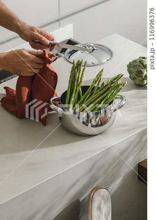 Assortment of fresh vegetables, linen towels and stainless still kitchen appliances. Healthy food cooking ingredients background with fresh vegetables Assortment of fresh vegetables, linen towels and stainless still kitchen appliances. Healthy food cooking ingredients background with fresh vegetables 116996376