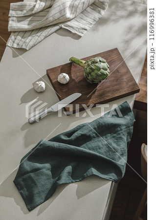 Assortment of fresh vegetables, linen towels and stainless still kitchen appliances. Healthy food cooking ingredients background with fresh vegetables Assortment of fresh vegetables, linen towels and stainless still kitchen appliances. Healthy food cooking ingredients background with fresh vegetables 116996381