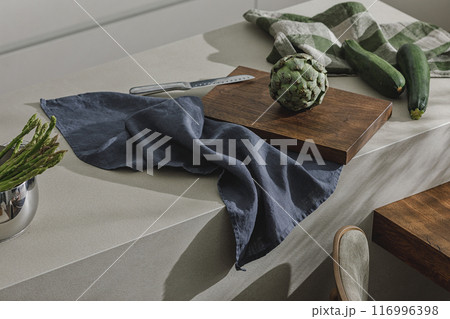 Assortment of fresh vegetables, linen towels and stainless still kitchen appliances. Healthy food cooking ingredients background with fresh vegetables Assortment of fresh vegetables, linen towels and stainless still kitchen appliances. Healthy food cooking ingredients background with fresh vegetables 116996398